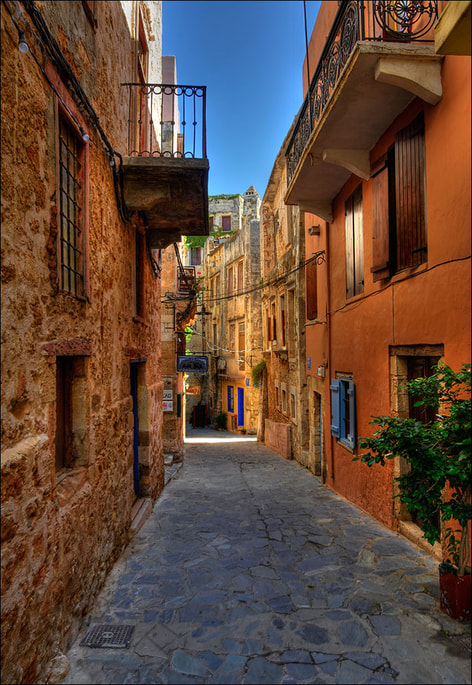 “Streets of Chania” by Romtomtom is licensed under CC BY 2.0