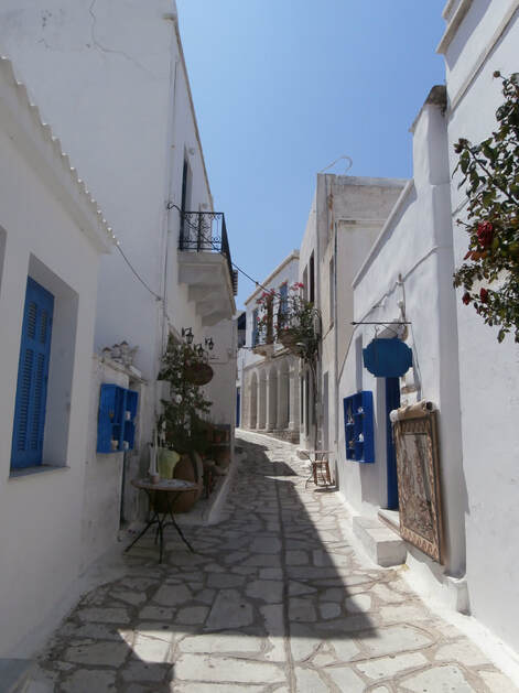 A picturesque narrow street on the island of Tinos.