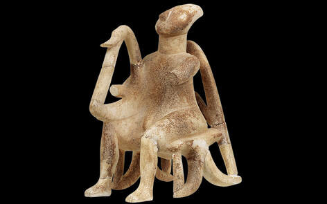 The Lyre Player. Marble figurine of a seated musician (Early Cycladic II period), from the island of Keros. The intricate carving is made from one piece. © National Archaeological Museum © Filippiadis