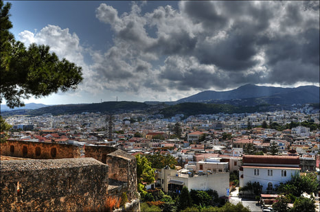 “Rethymnon view” by Romtomtom is licensed under CC BY 2.0